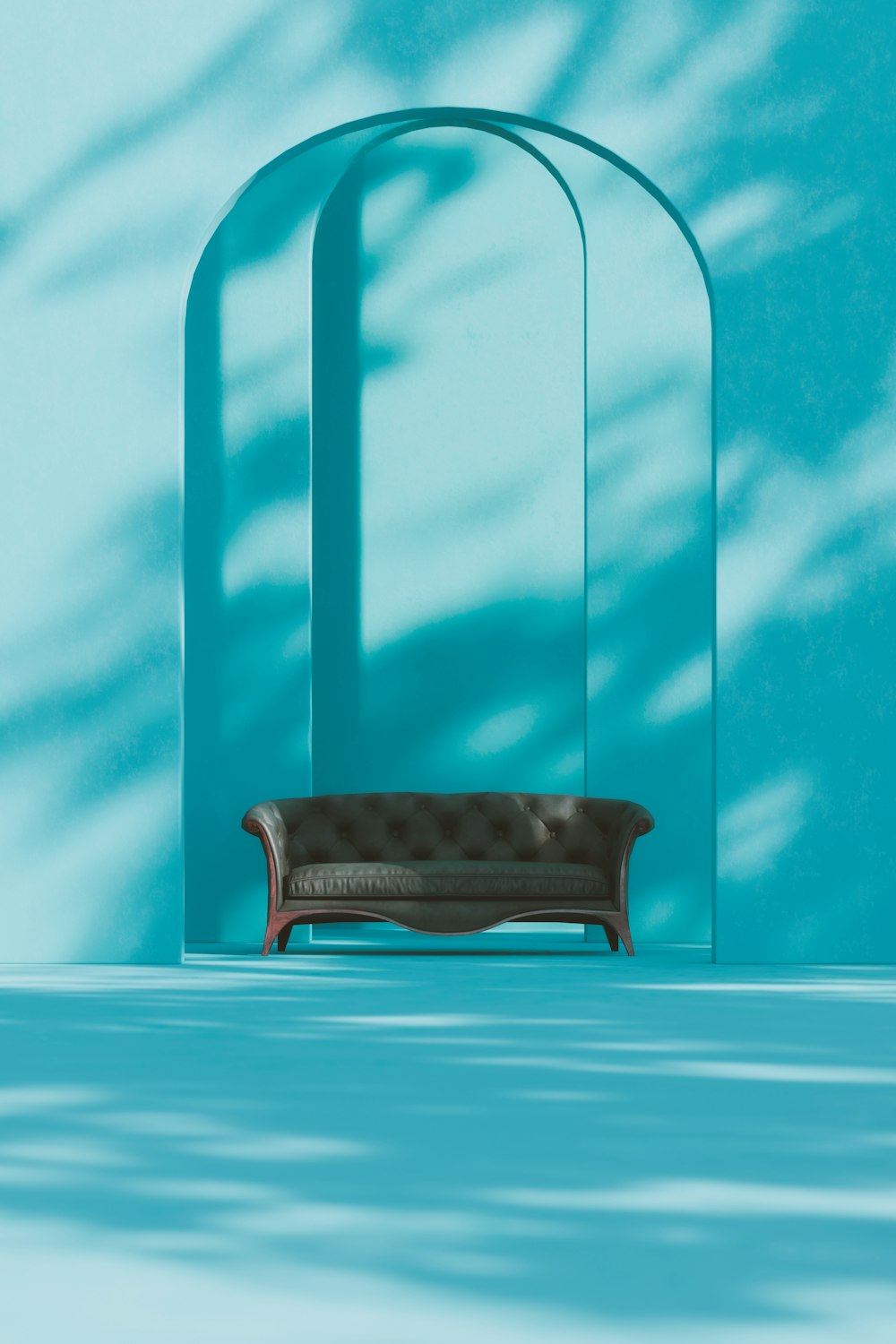 a couch sitting in front of a blue wall