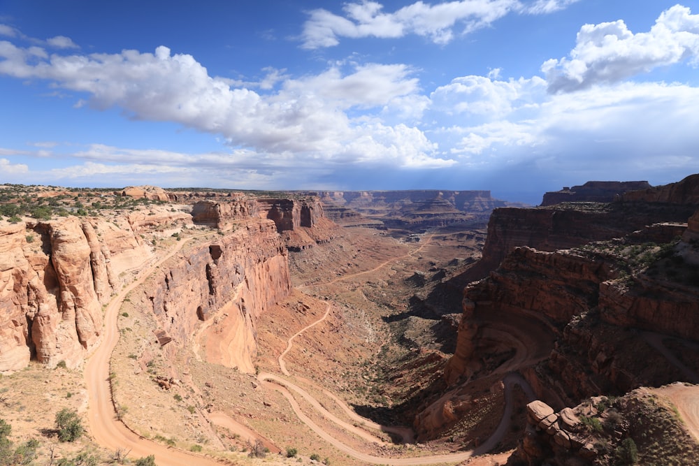 a view of a canyon with a dirt road going through it