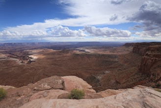 a scenic view of a canyon and mountains