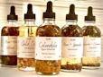 a row of bottles filled with different types of liquid