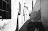 a woman in a hijab walking down a street