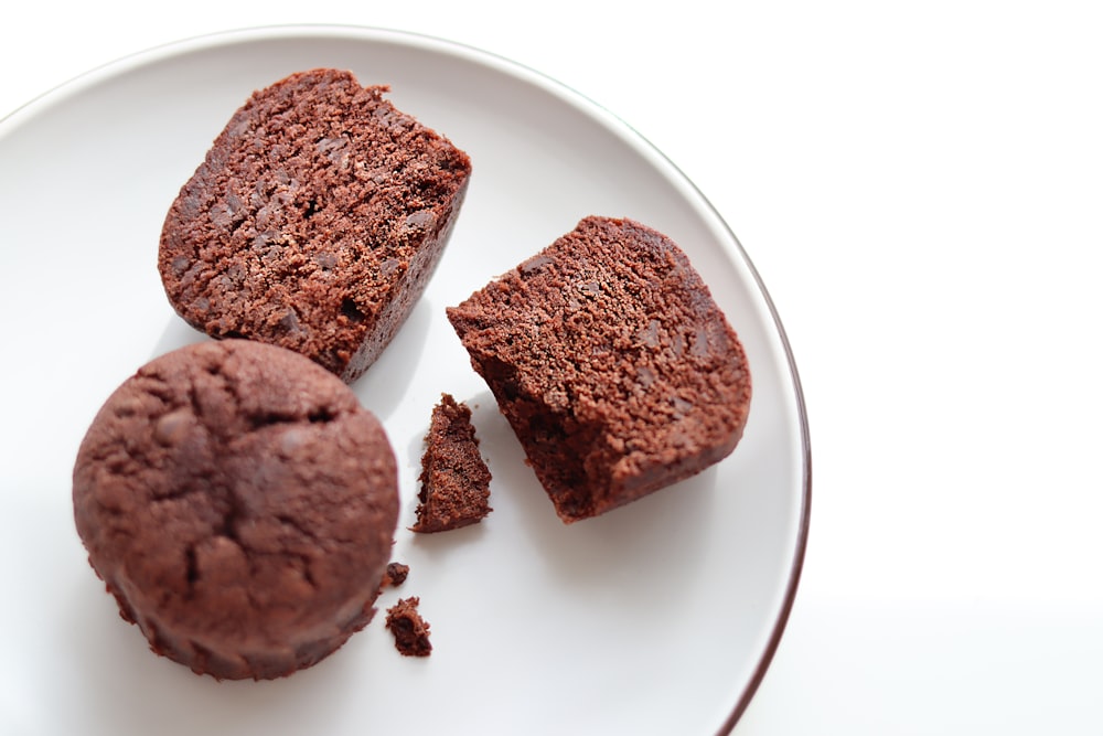 three pieces of chocolate cake on a plate