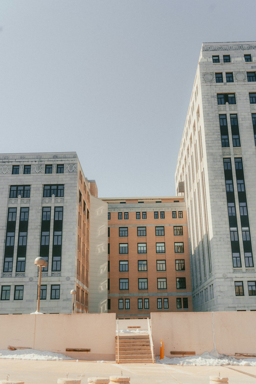 a couple of tall buildings sitting next to each other