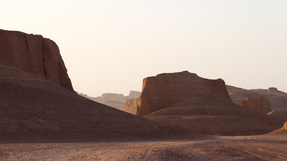 a dirt road in the middle of a desert