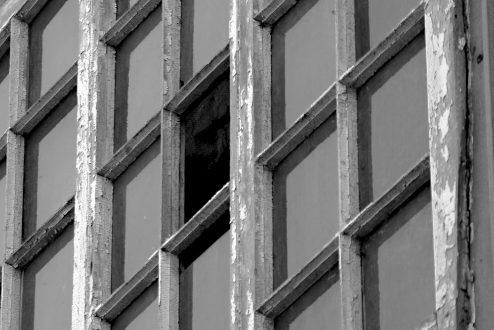 a black and white photo of a window in a building