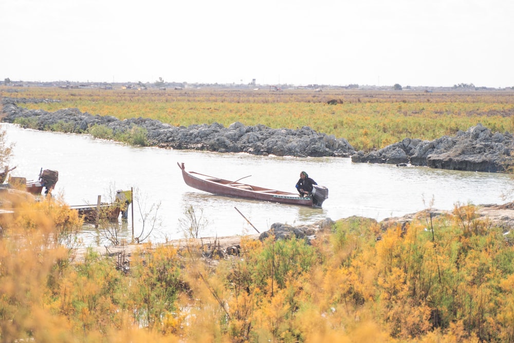 a person in a boat on a body of water