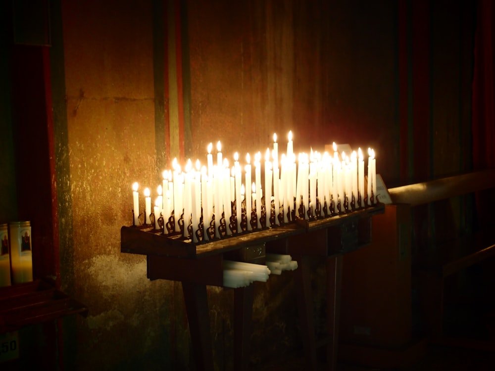 a bunch of candles that are on a table