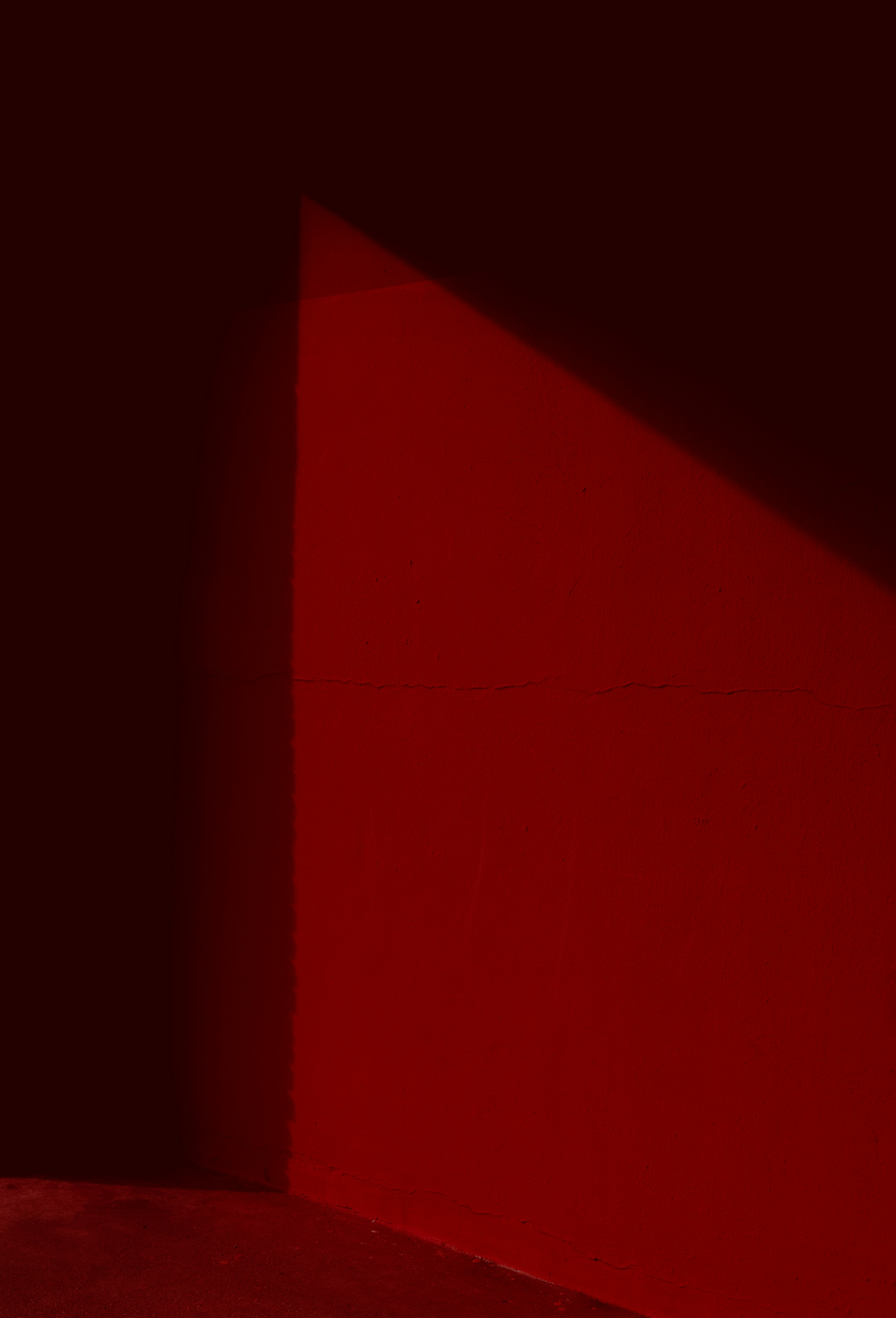 a person sitting on a bench in a dark room