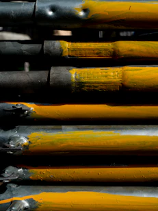 a close up of a bunch of yellow and black paint
