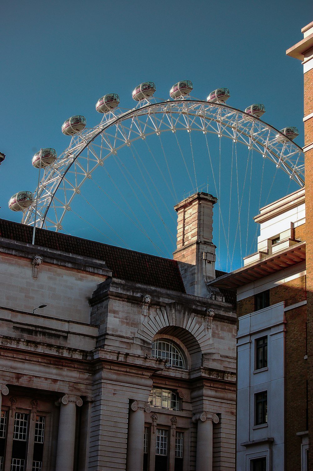 a large ferris wheel on top of a building