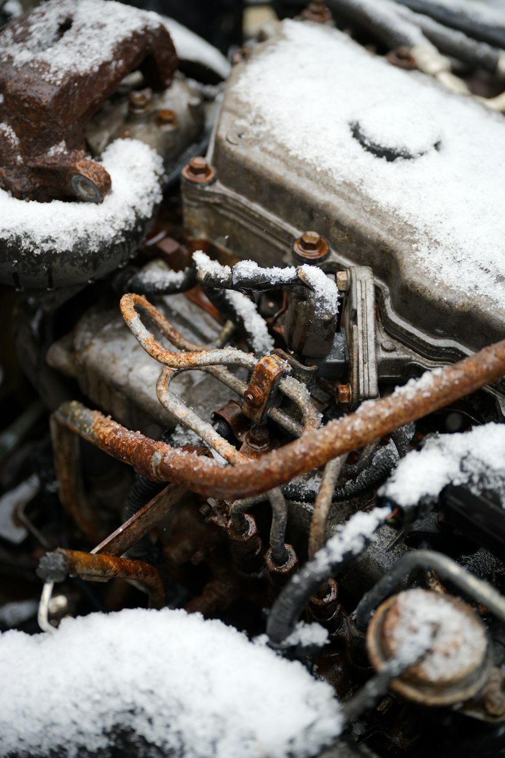 the engine of a car covered in snow