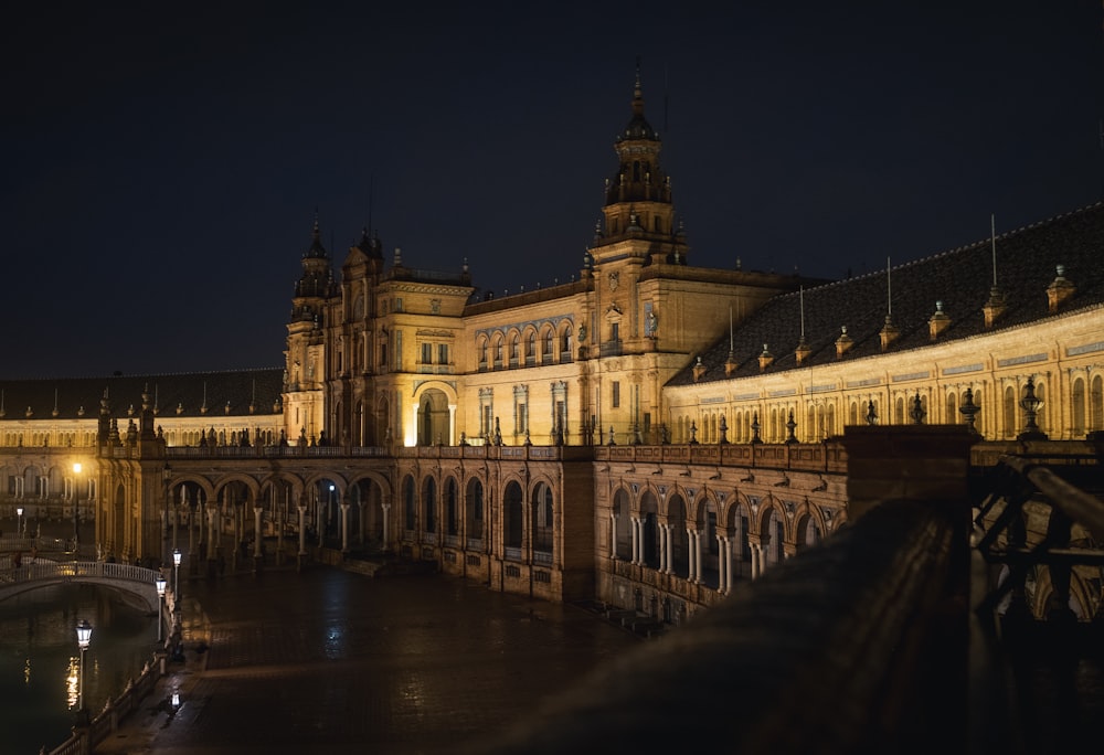 a large building with a clock tower at night