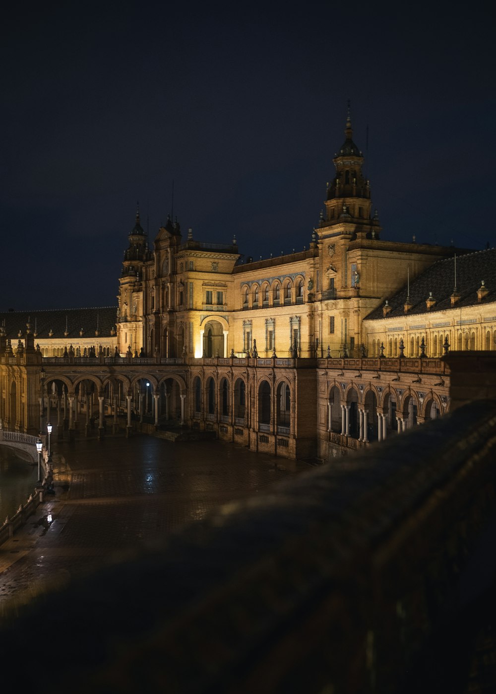 a large building with a clock tower at night