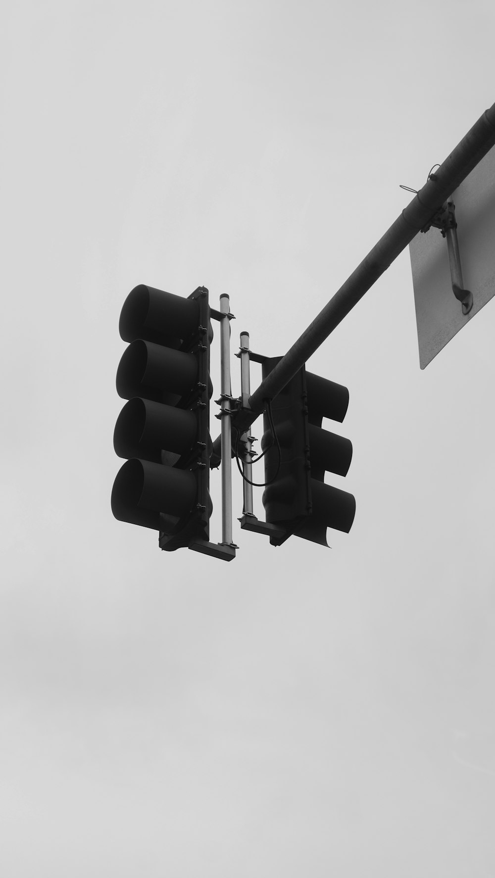 a black and white photo of a traffic light