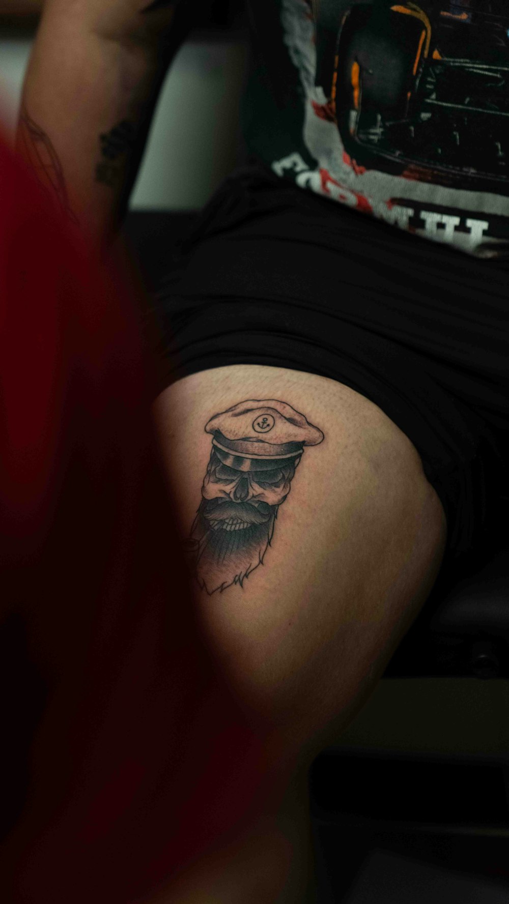 a man with a tattoo on his leg