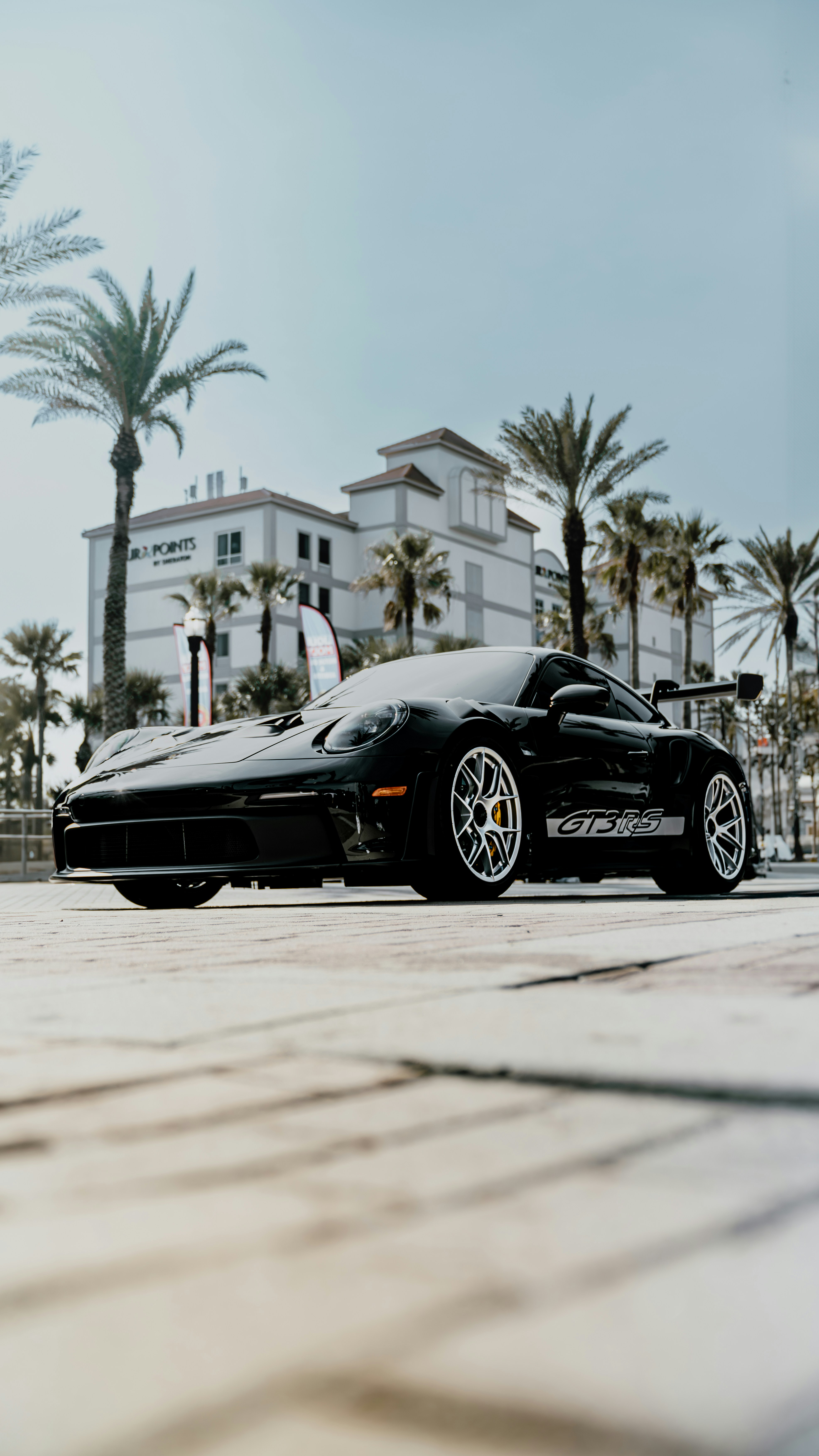 a black sports car parked on the side of the road