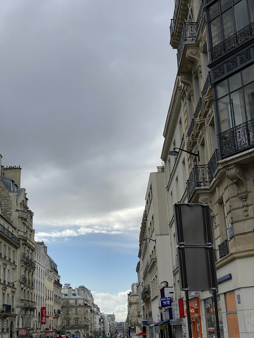 a city street filled with lots of tall buildings