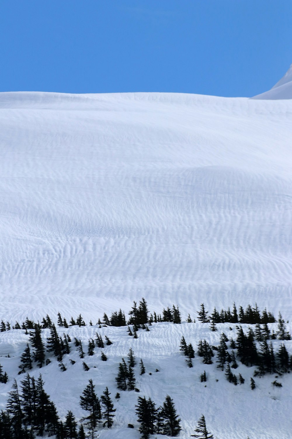 a person skiing down a snow covered mountain