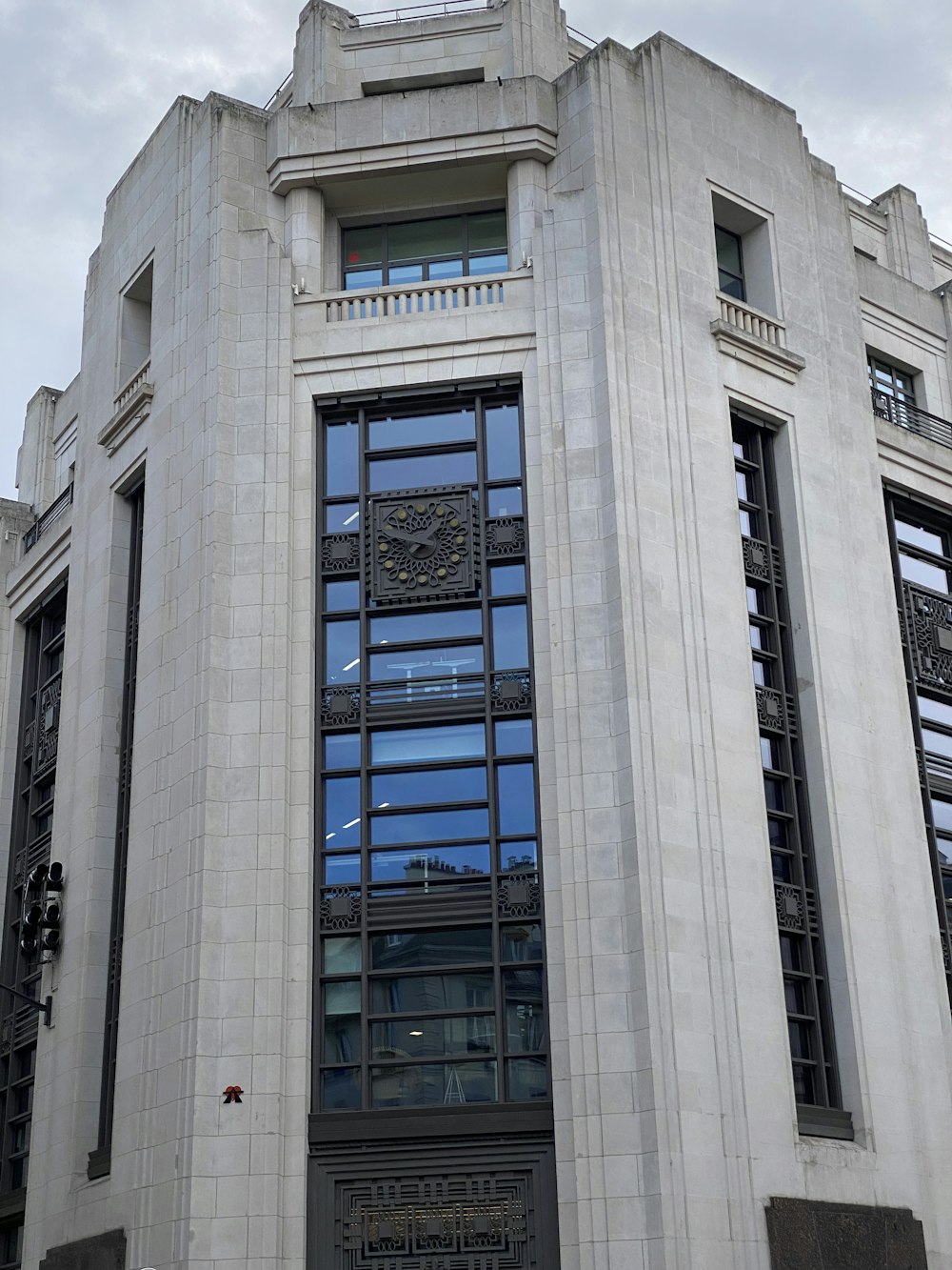 a tall building with a clock on the front of it