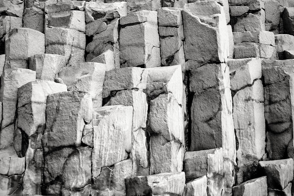 a black and white photo of large rocks