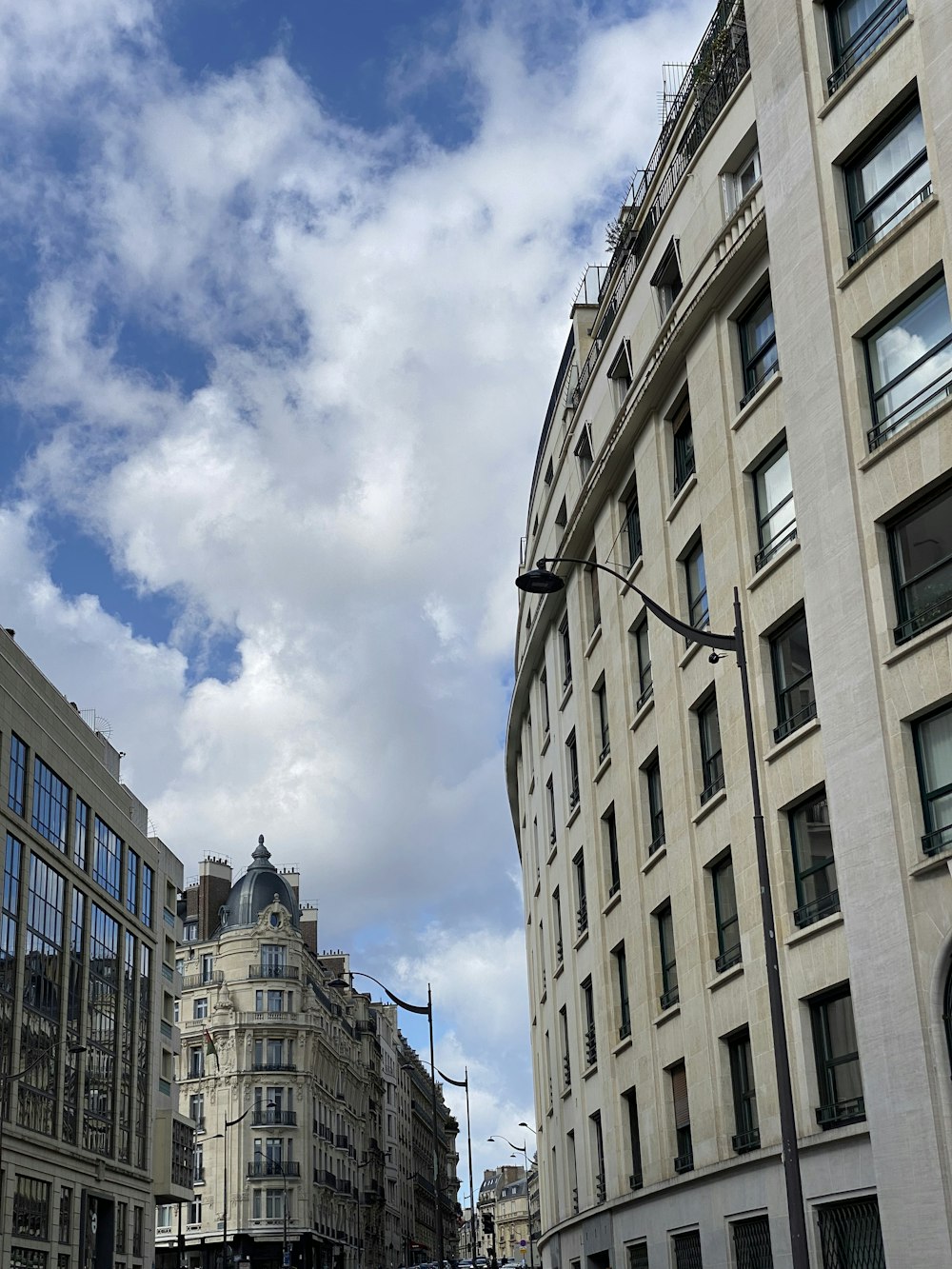 a city street filled with traffic and tall buildings