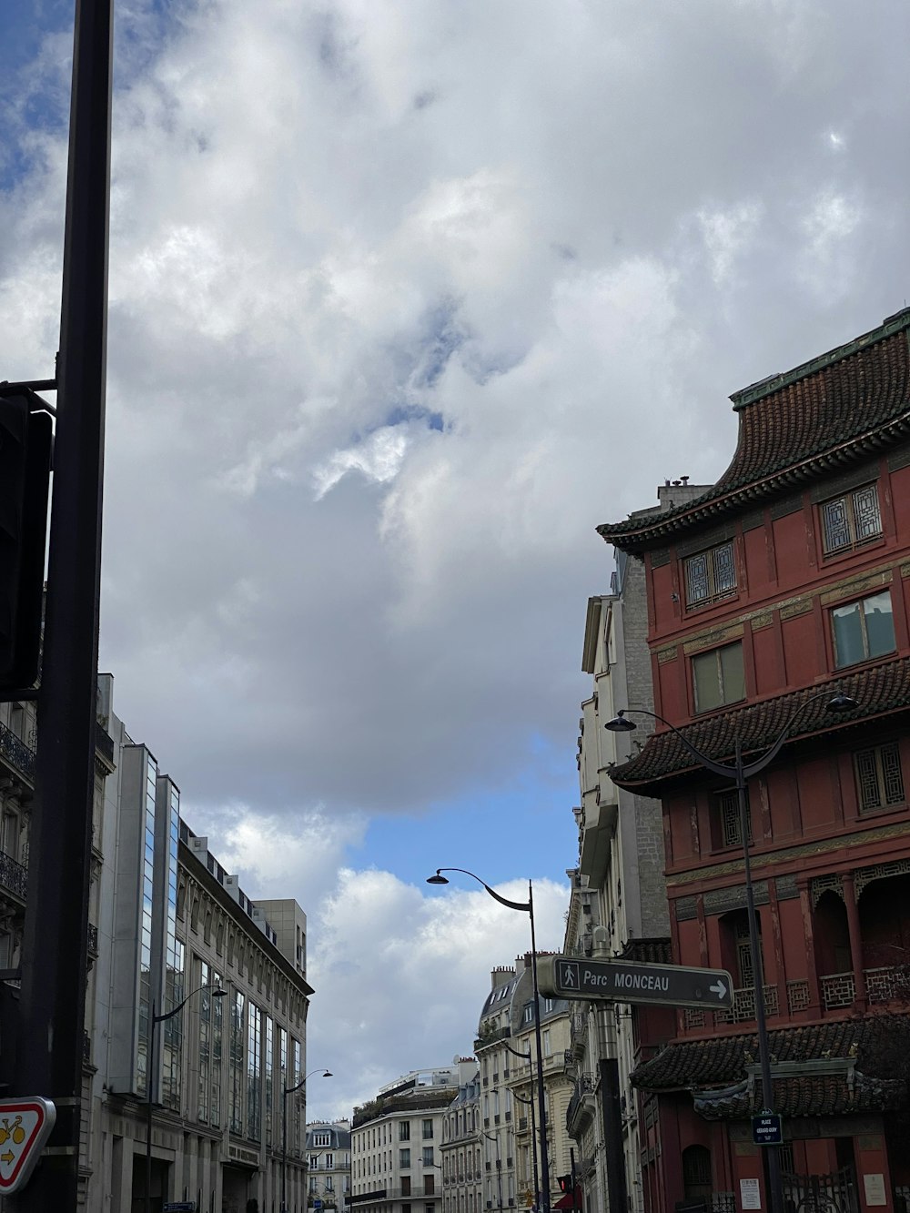 a city street with buildings and a traffic light