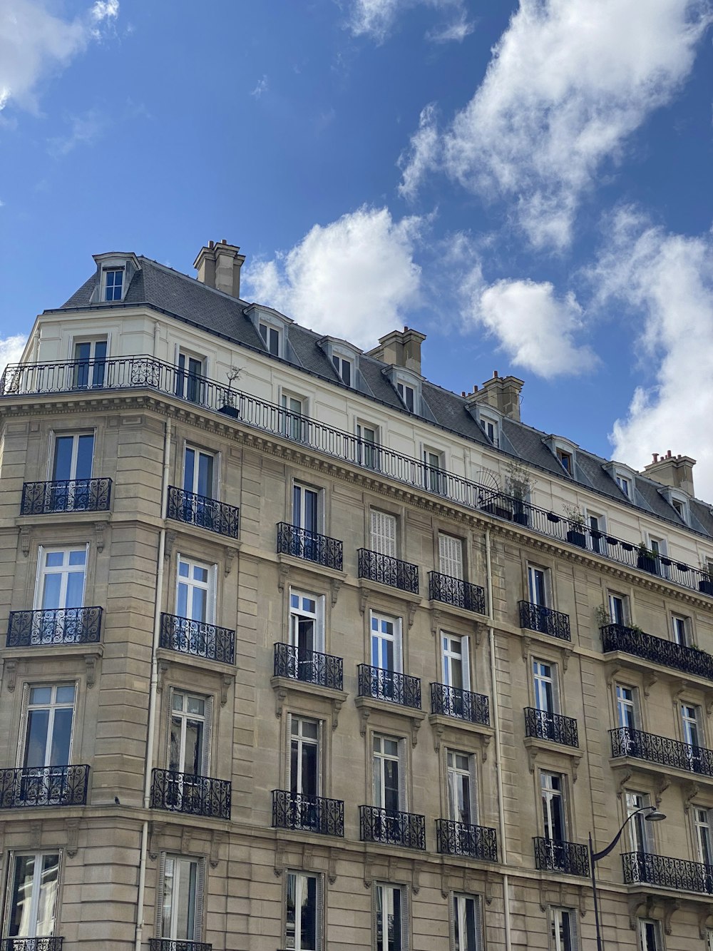 a tall building with balconies and balconies on the top of it