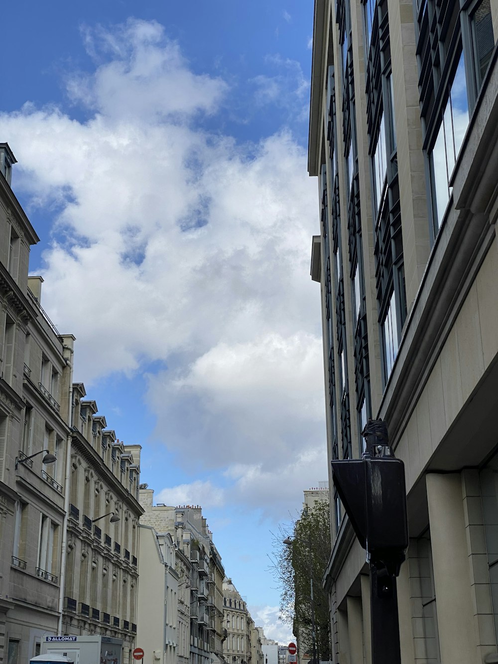 a city street with tall buildings on both sides