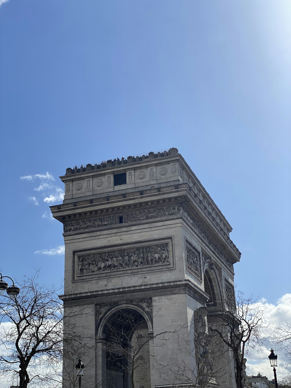 a very tall tower with a clock on it's side