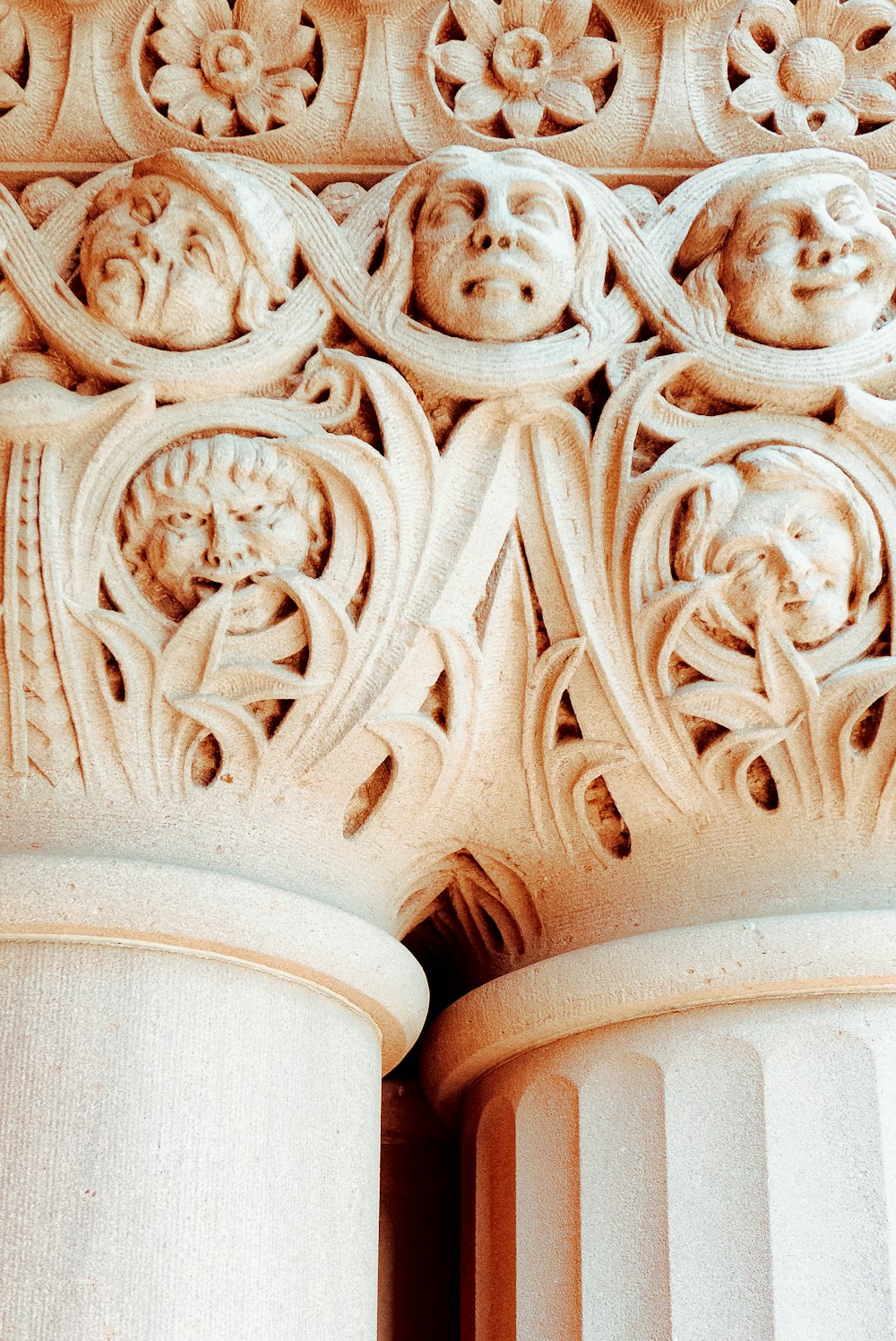 a close up of a column with carvings on it