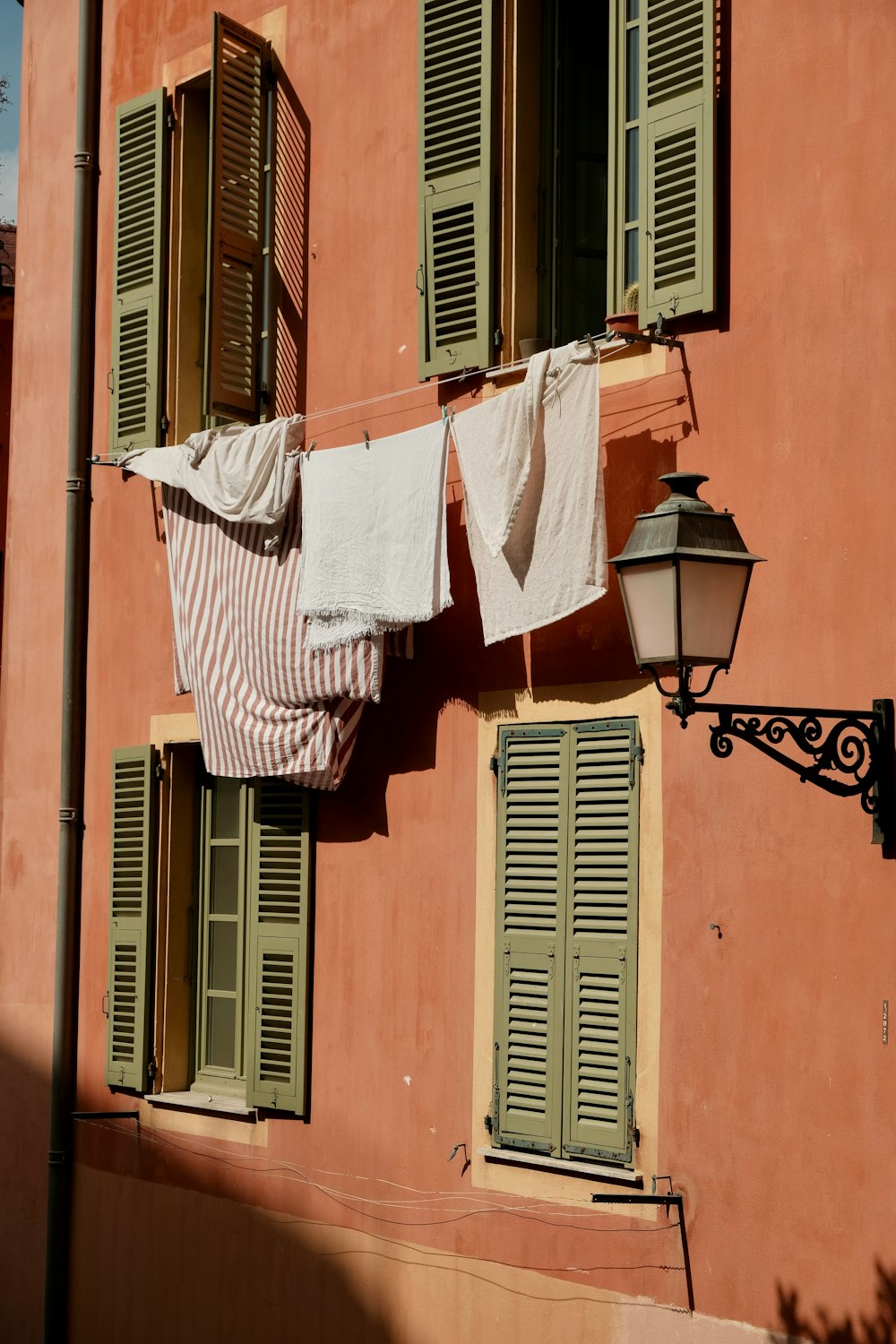 clothes hanging out to dry in front of a building
