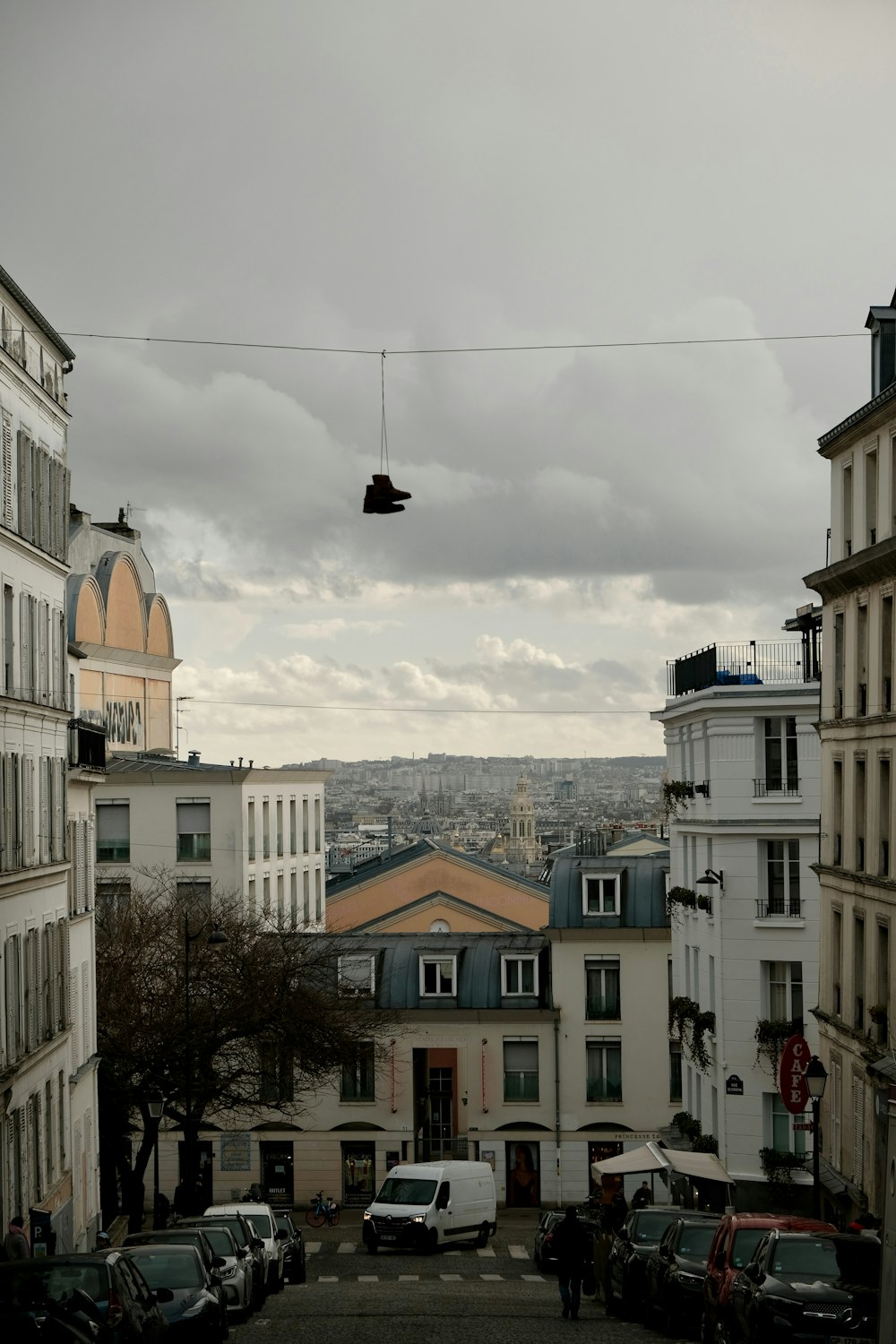 a view of a street with cars parked on the side of it