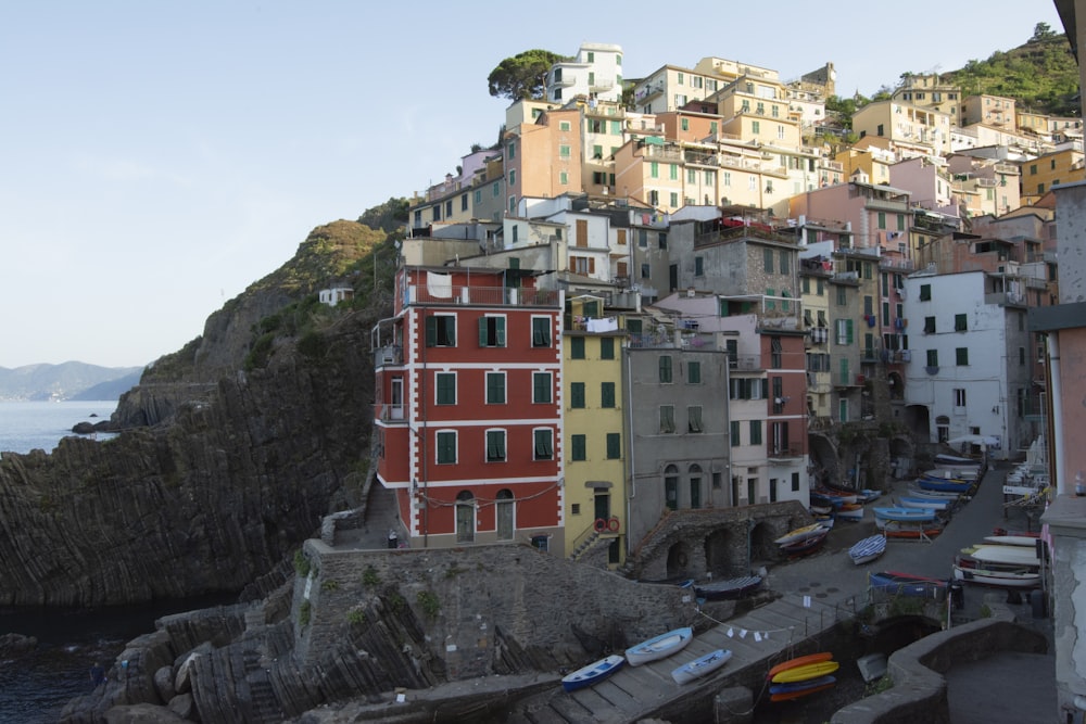 a group of buildings on the side of a cliff