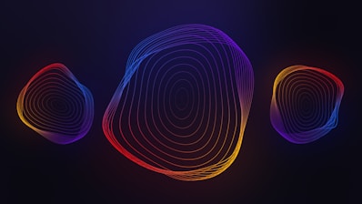 a set of three abstract shapes on a dark background