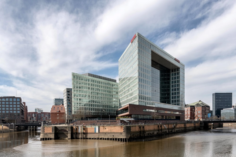 a large building sitting next to a body of water