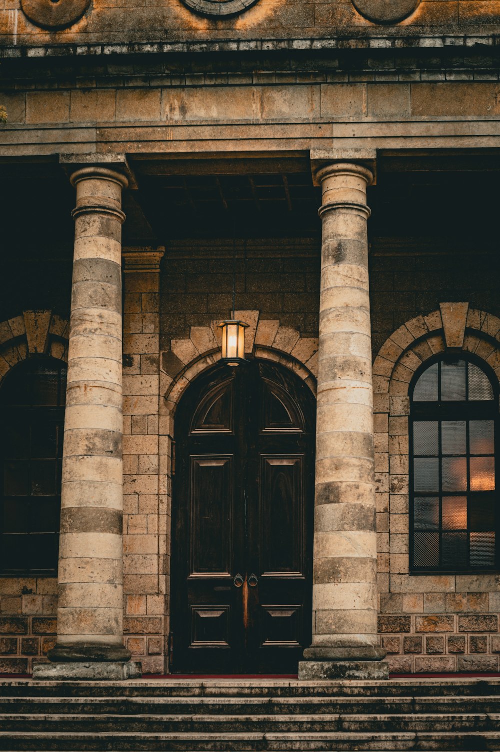 a couple of doors sitting next to each other in front of a building