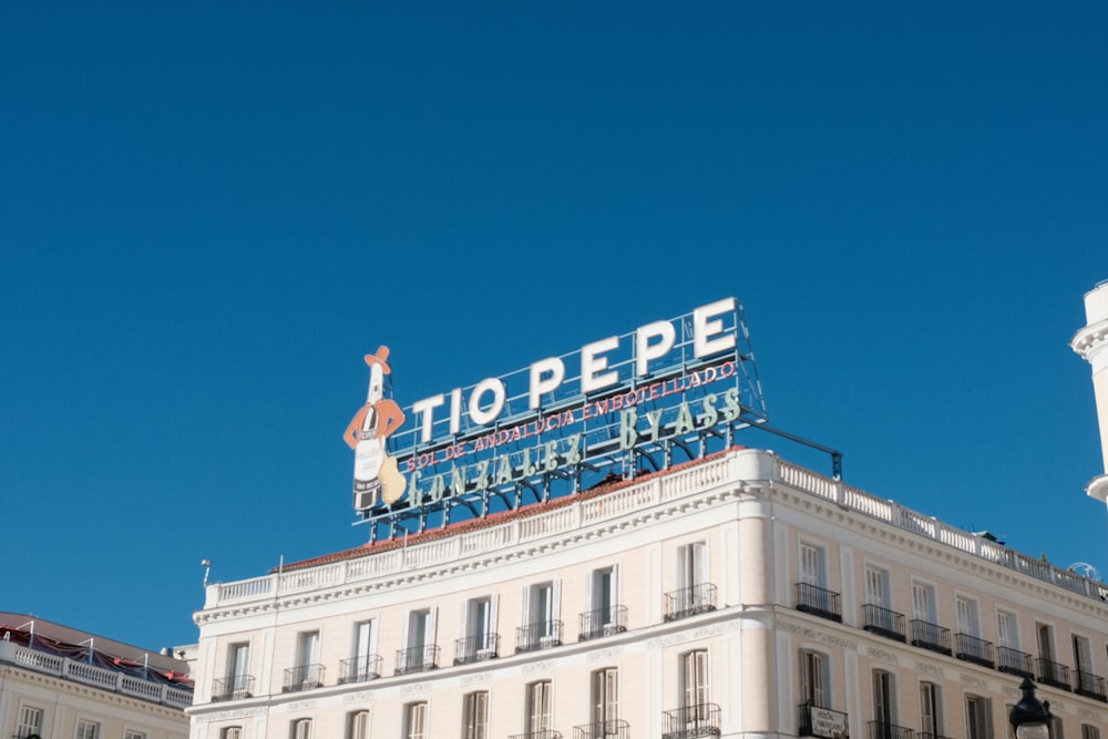 a large white building with a sign on top of it