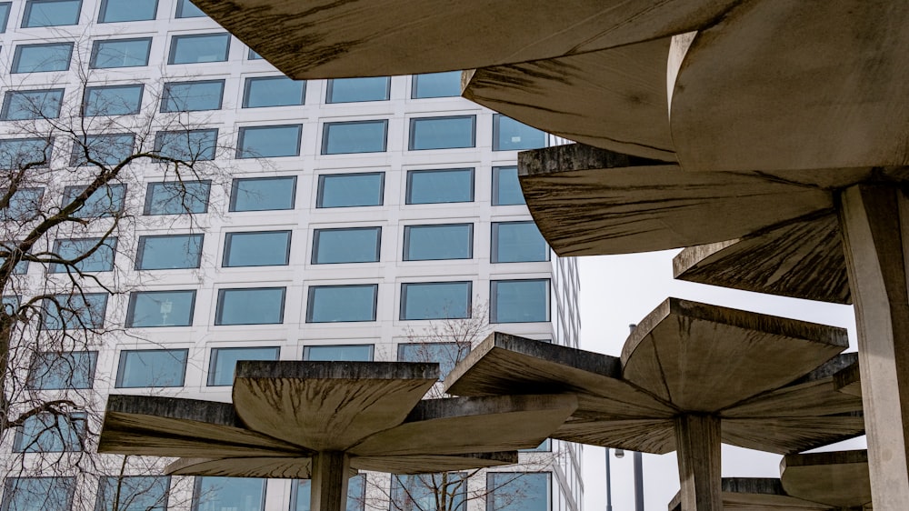 a group of umbrellas sitting in front of a tall building