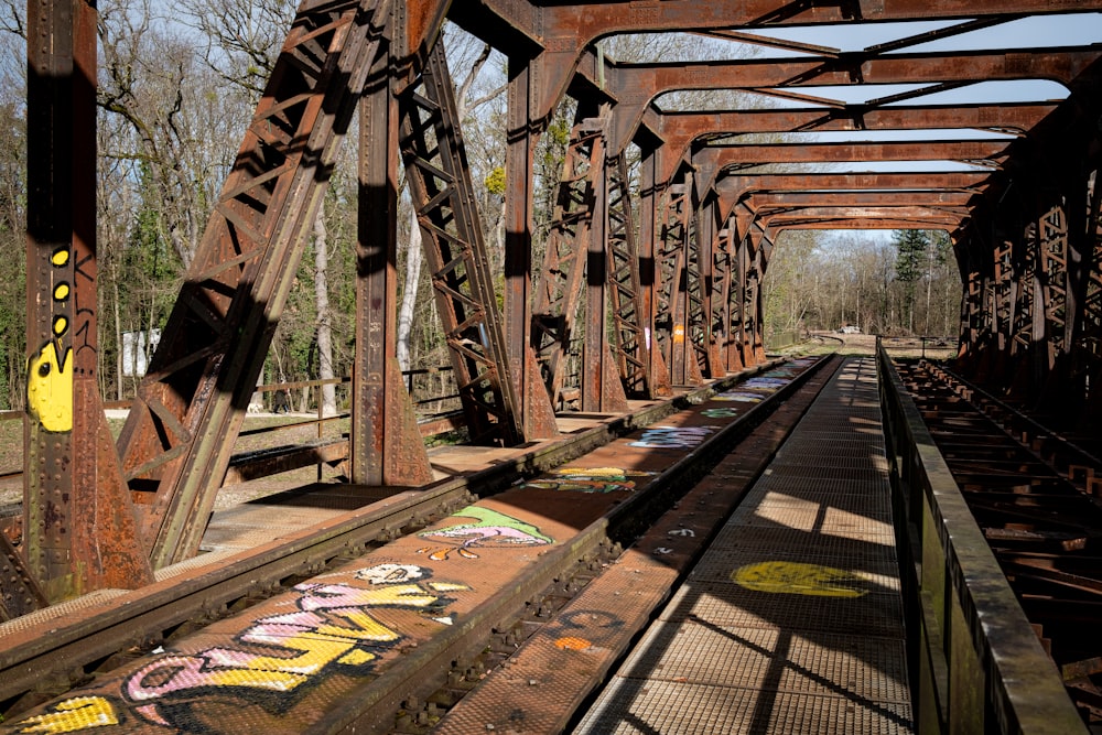 a train track with graffiti painted on it