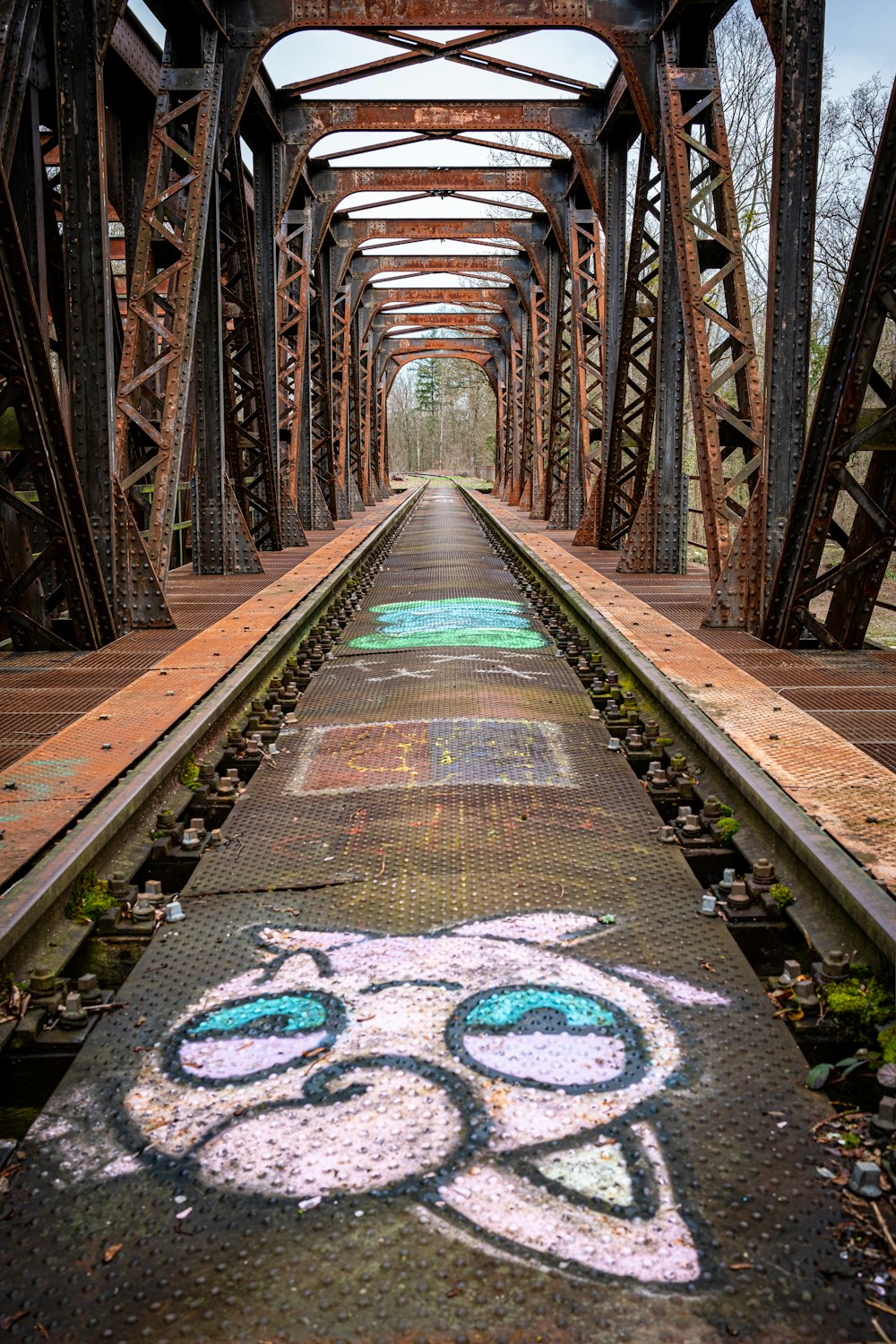 graffiti on the side of a train track