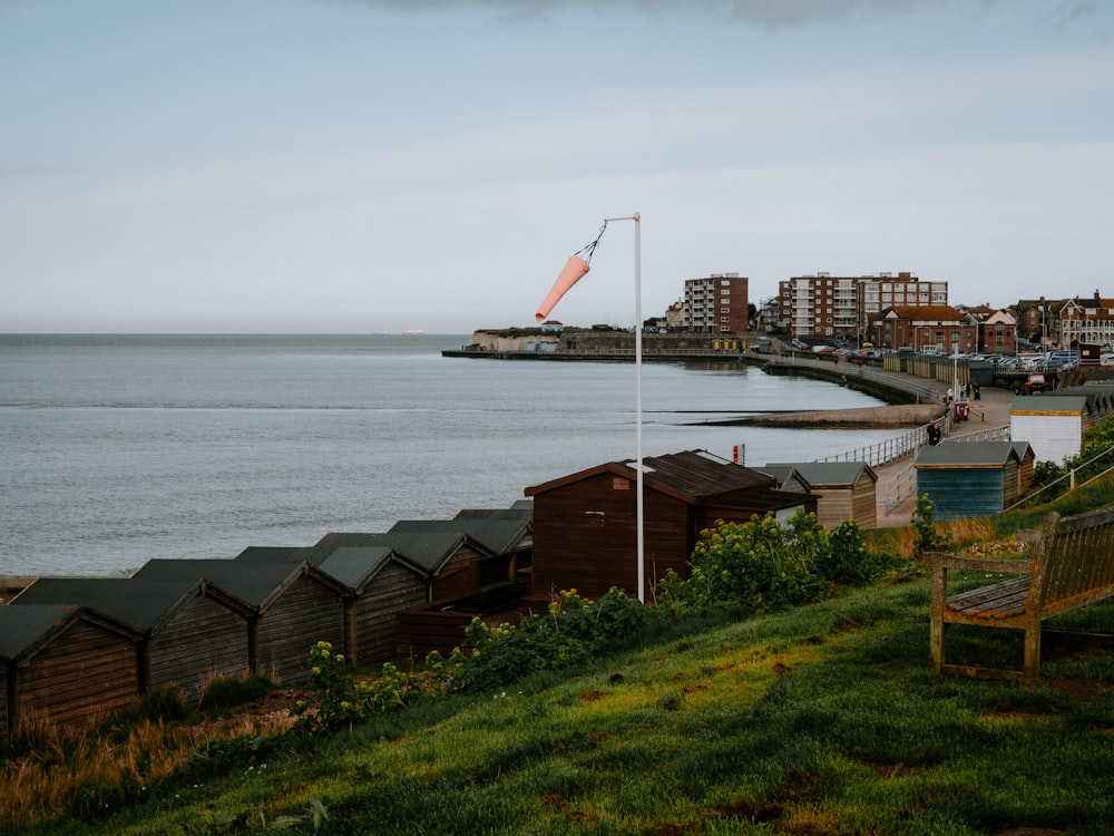 a view of a body of water with houses in the background