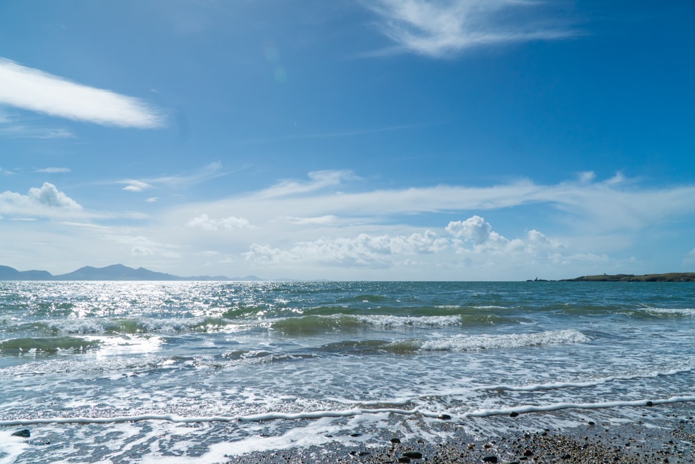 a view of the ocean from the shore of a beach