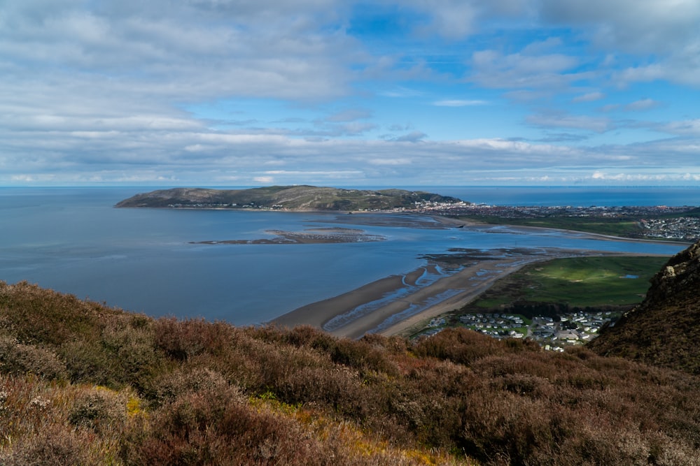 a view of a beach from a hill