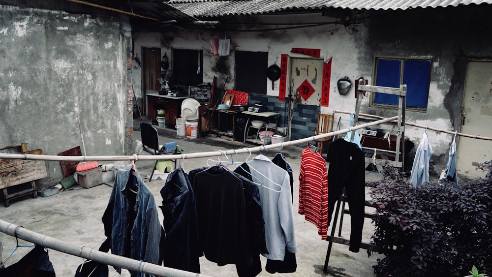 clothes hanging on a clothes line outside of a building