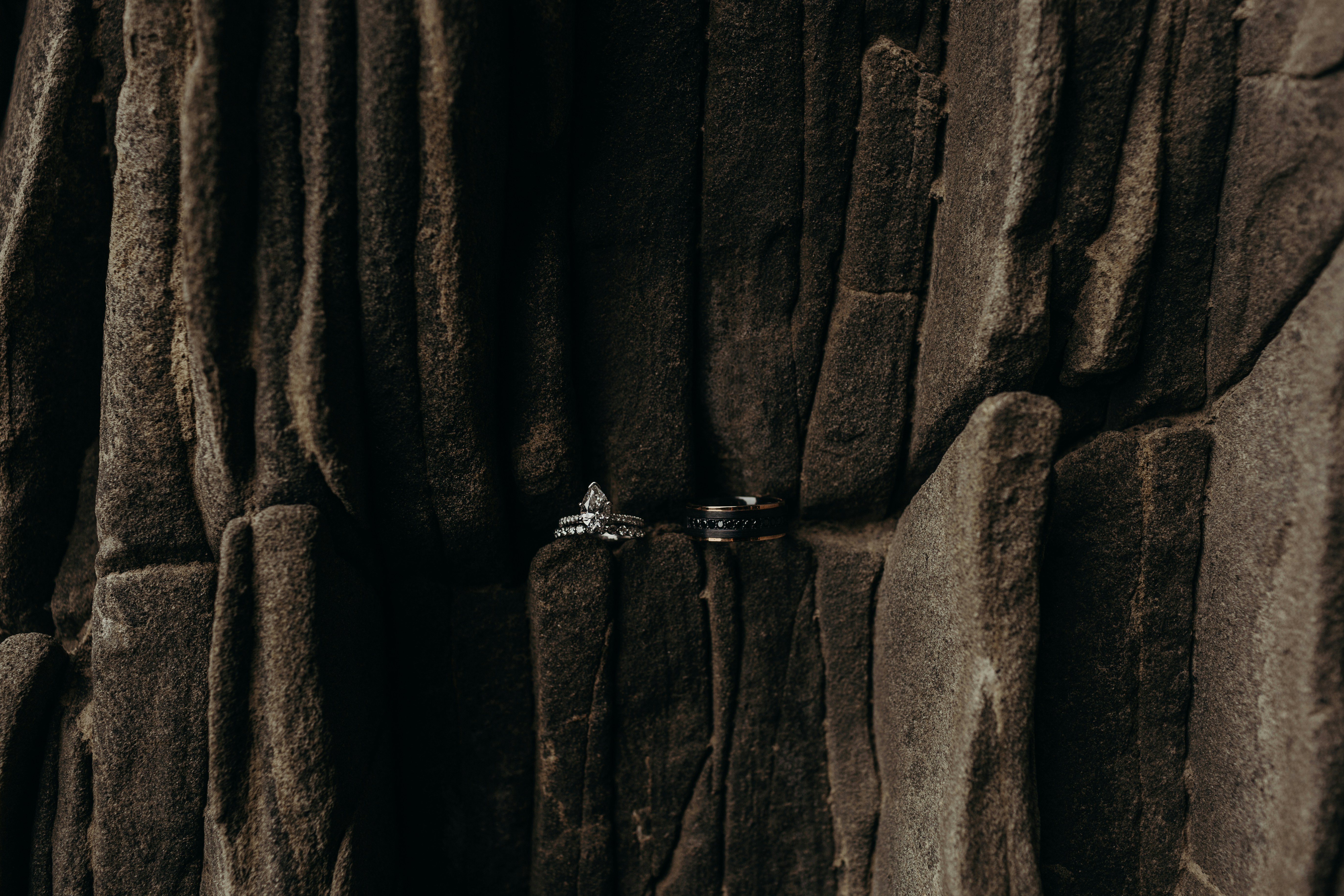 Wedding bands with diamonds on the basalt.