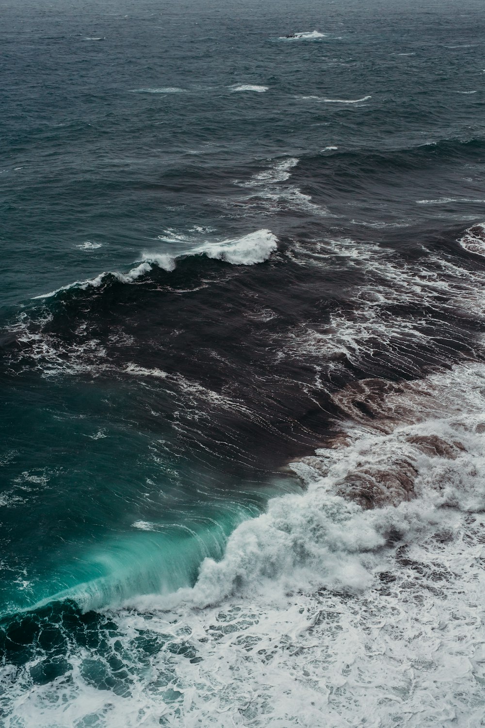 a large body of water surrounded by waves