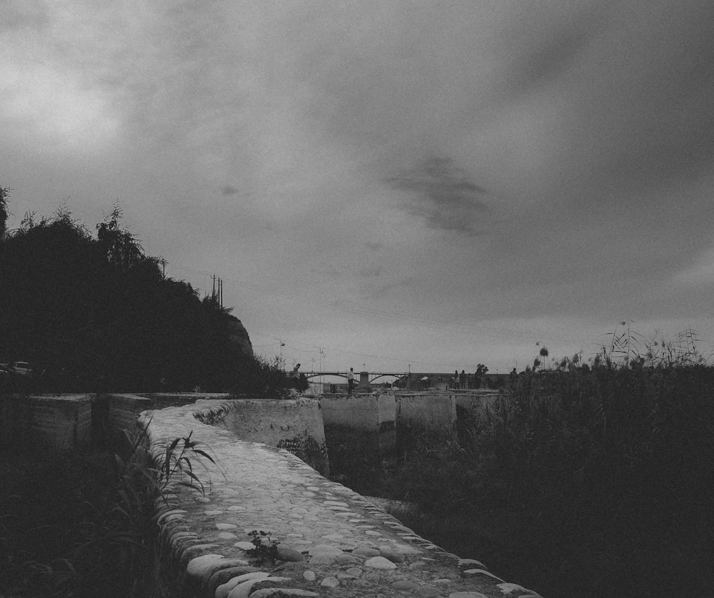 a black and white photo of a stone wall