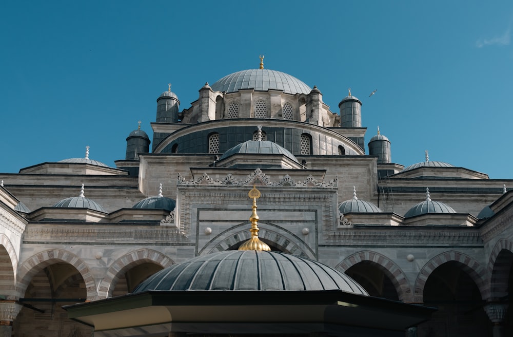 a large building with a dome and a clock on the front of it