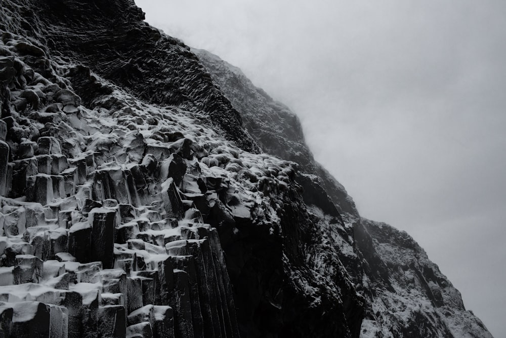 a mountain side covered in snow and ice