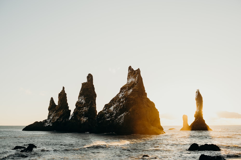 a group of rock formations in the ocean